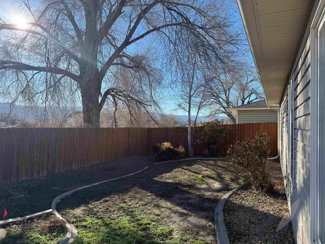 a view of a backyard of the house