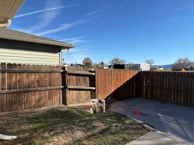 a view of a house with a wooden deck