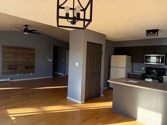 a view of a livingroom with kitchen