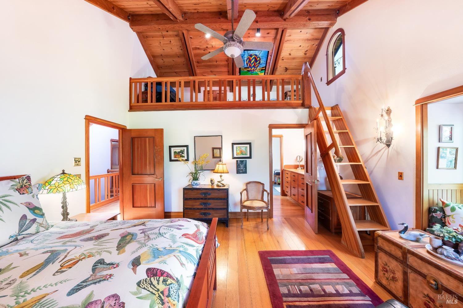 4034 Spring Mountain Road St. Helena, CA 94574 - Photo 14 of 36 a view of a bedroom with furniture and staircase