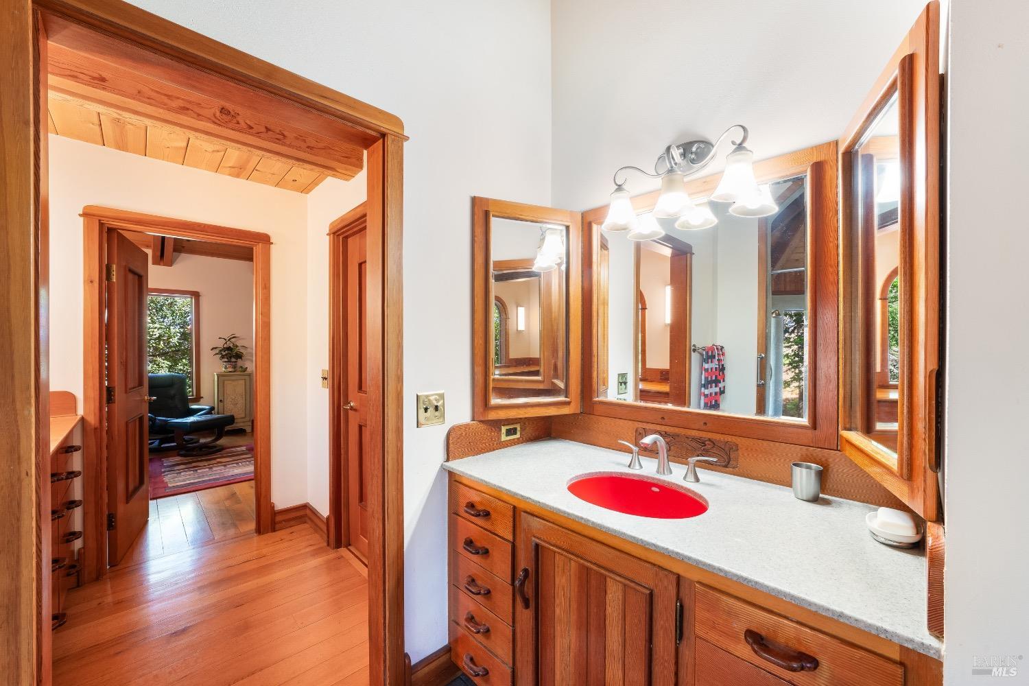 4034 Spring Mountain Road St. Helena, CA 94574 - Photo 17 of 36 a bathroom with a sink vanity and a mirror