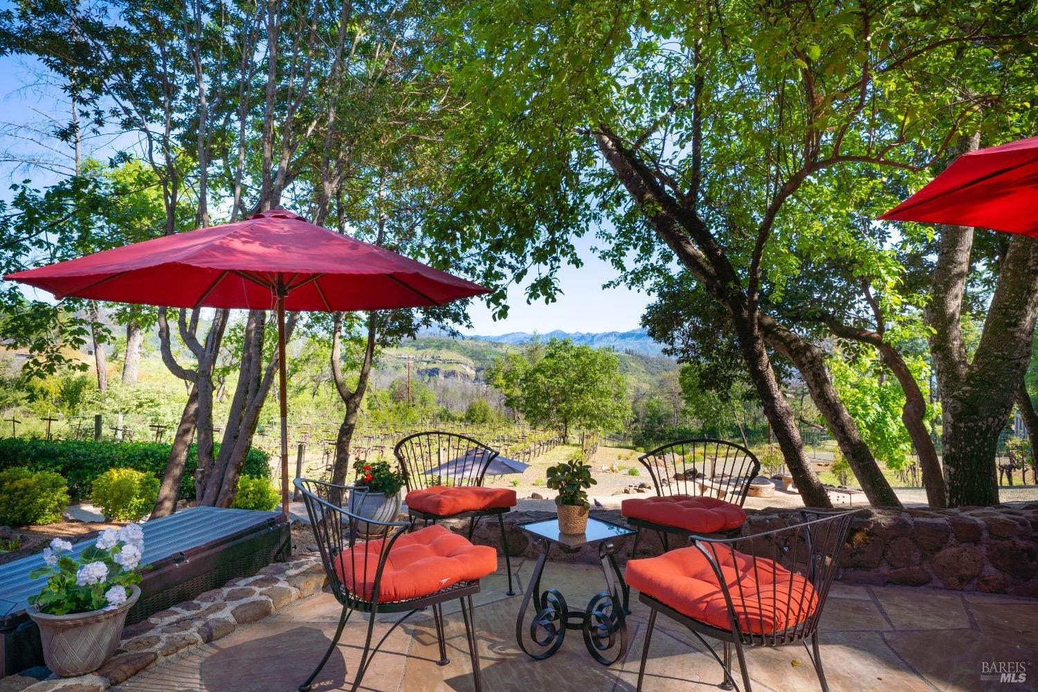 4034 Spring Mountain Road St. Helena, CA 94574 - Photo 29 of 36 a balcony with wooden floor table and chairs