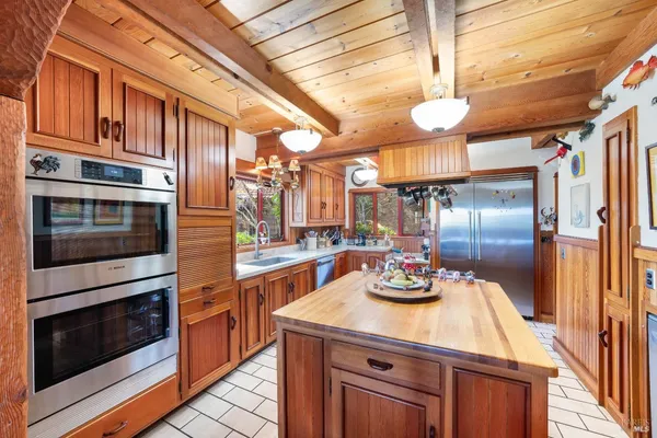a kitchen with stainless steel appliances a stove and a refrigerator