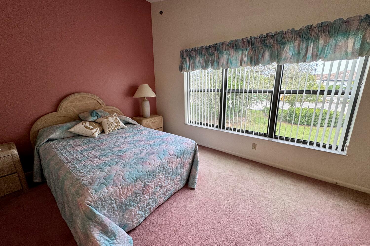 3991 Southwest Greenwood Way, Unit I Palm City, FL 34990 - Photo 12 of 15 a bedroom with a bed and a large window