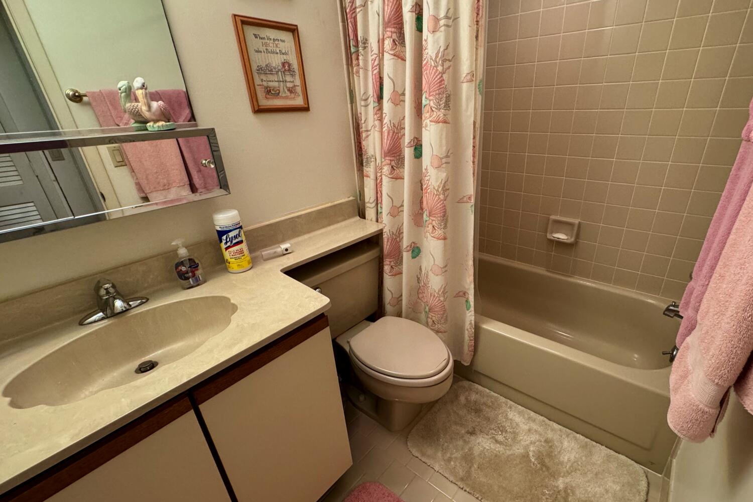 3991 Southwest Greenwood Way, Unit I Palm City, FL 34990 - Photo 13 of 15 a bathroom with a sink toilet and shower