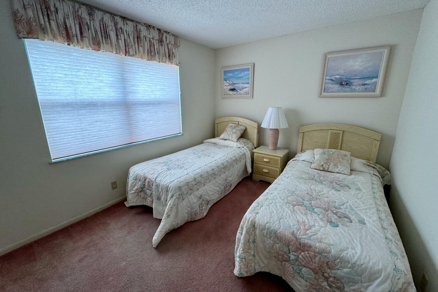 3991 Southwest Greenwood Way, Unit I Palm City, FL 34990 - Photo 14 of 15 a bedroom with two beds and a window
