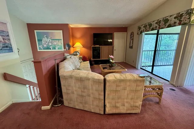 a bed room with furniture and a window