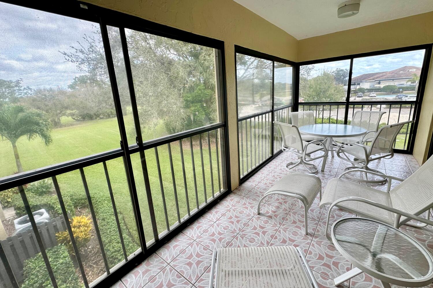 3991 Southwest Greenwood Way, Unit I Palm City, FL 34990 - Photo 8 of 15 a view of a city from a balcony with furniture