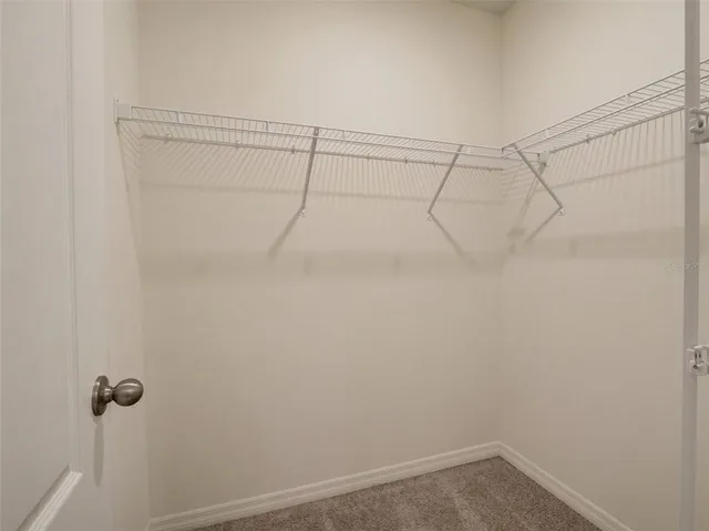a view of a room with racks on the wall