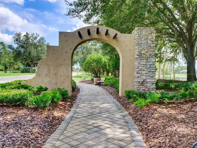 a front view of a house with a yard garage and outdoor seating