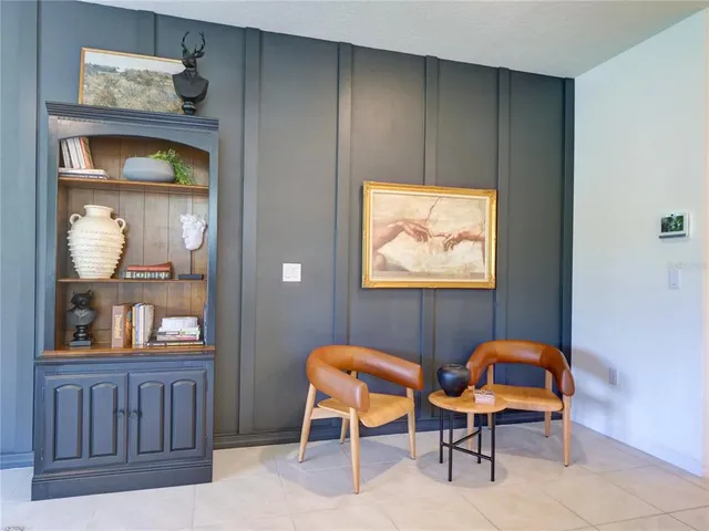 a room with furniture and wooden floor