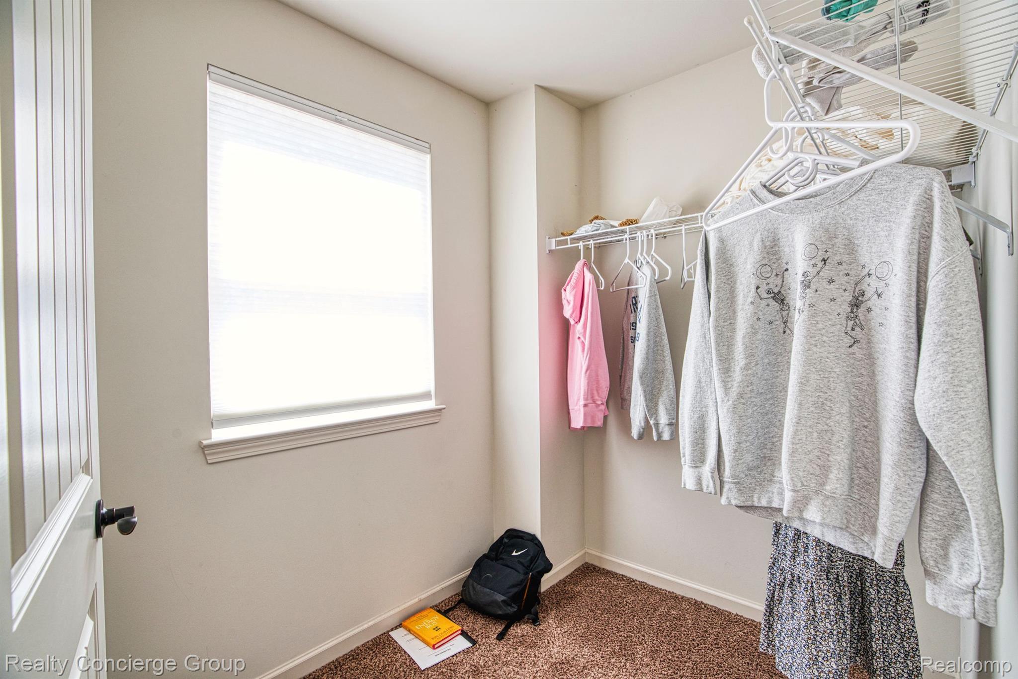 1171 Cannonade Loop Howell, MI 48843 - Photo 15 of 27 Large walk in closet w/ natural lighting & shelves