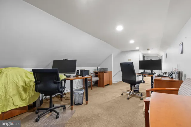 a view of a workspace with furniture and a chair