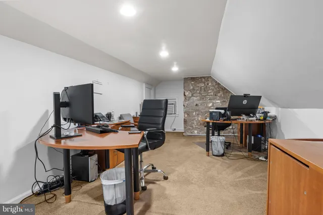 a view of a workspace with furniture