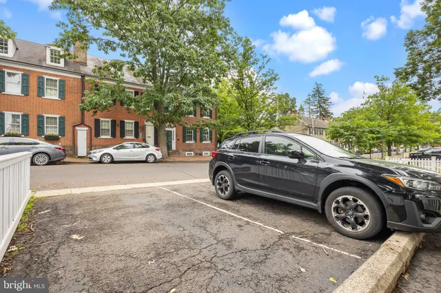 a view of a car parked in front of a building