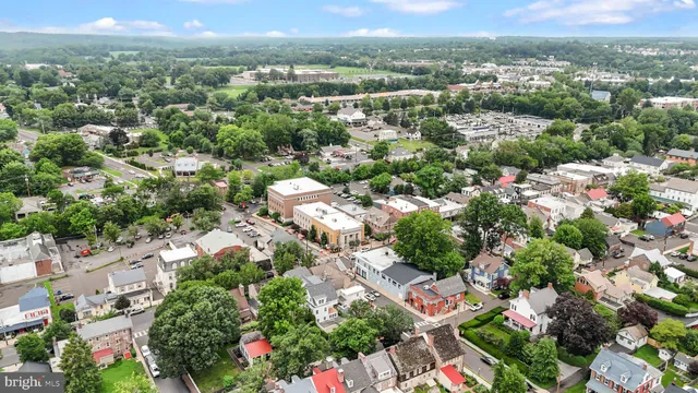 an aerial view of a house with a yard and garden