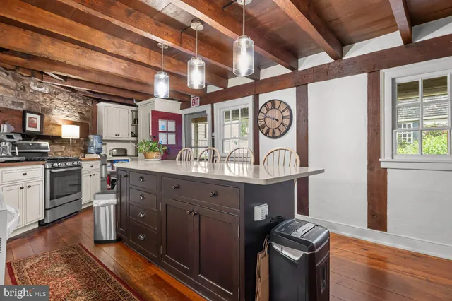 a kitchen with stainless steel appliances granite countertop a stove and a sink