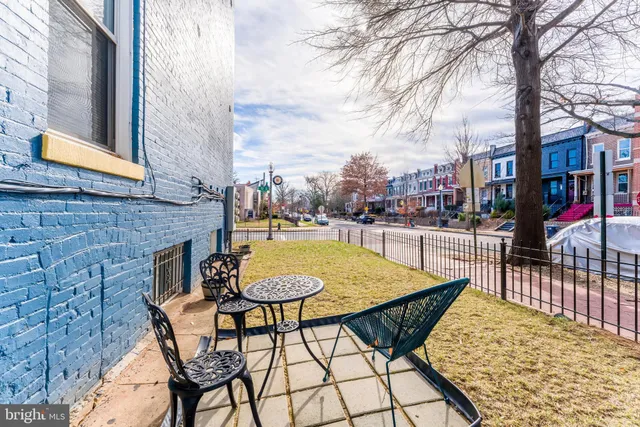 a view of a chairs and tables in the patio