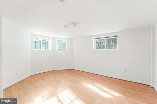 a view of empty room with windows