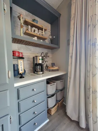 a kitchen with a sink and a refrigerator