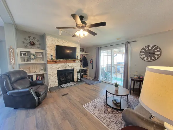 a view of a house and wooden floor