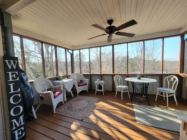 a spacious bathroom with a tub sink shower and mirror