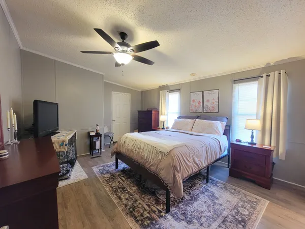 a view of hall way with furniture and window