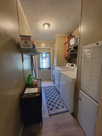a view of a house with furniture and a yard