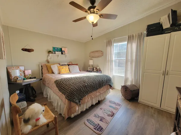 a white bath tub sitting in the middle of a yard