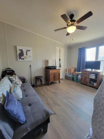 a view of a backyard with wooden fence