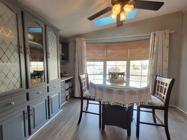 a kitchen with granite countertop wooden cabinets and stainless steel appliances
