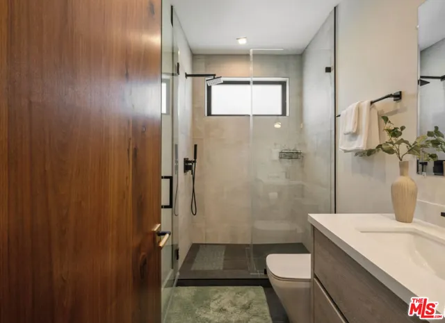 a bathroom with a sink and toilet