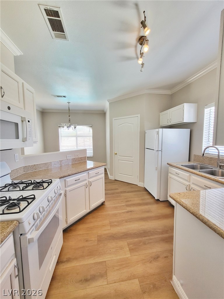 5525 West Flamingo Road, Unit 2040 Las Vegas, NV 89103 - Photo 4 of 15 A well-equipped kitchen showcasing elegant granite countertops and modern appliances.