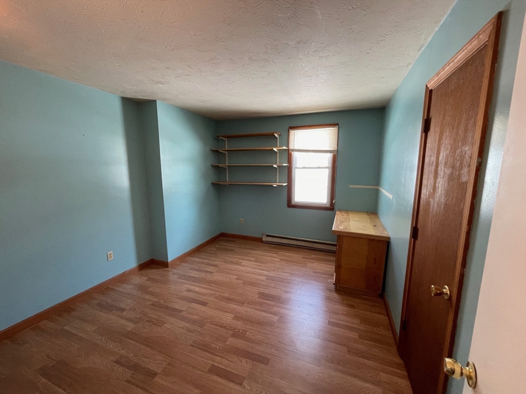 35 Ellis Road Southbridge, MA 01550 - Photo 12 of 29 a view of empty room with wooden floor and fan