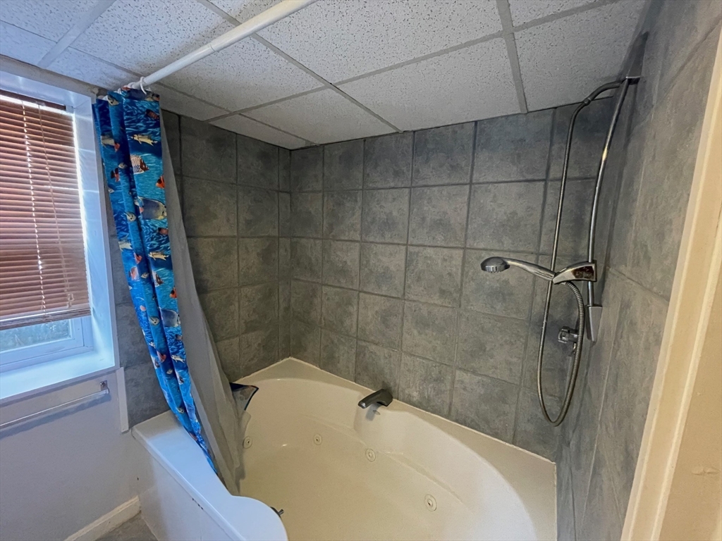 35 Ellis Road Southbridge, MA 01550 - Photo 20 of 29 a bathroom with a bathtub and shower