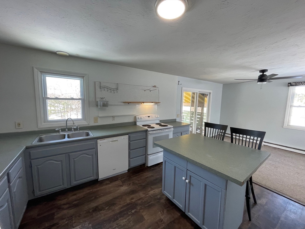 35 Ellis Road Southbridge, MA 01550 - Photo 6 of 29 a kitchen with granite countertop a sink cabinets and window