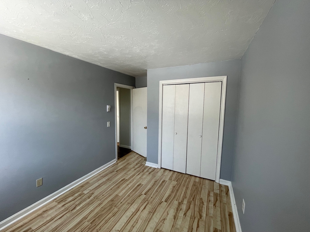 35 Ellis Road Southbridge, MA 01550 - Photo 9 of 29 a view of an empty room with wooden floor