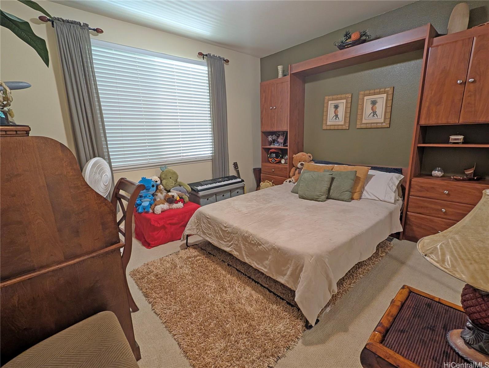 92-1057 Koio Drive, Unit F Kapolei, HI 96707 - Photo 11 of 18 Second Bedroom with Murphy Bed