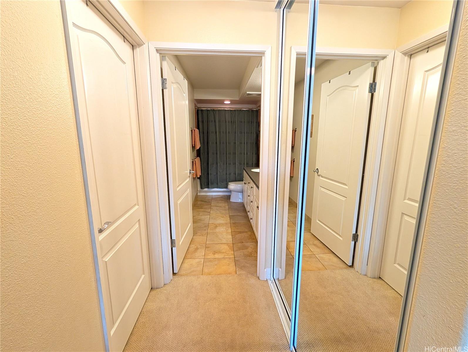 92-1057 Koio Drive, Unit F Kapolei, HI 96707 - Photo 9 of 18 Primary Bedroom Closets