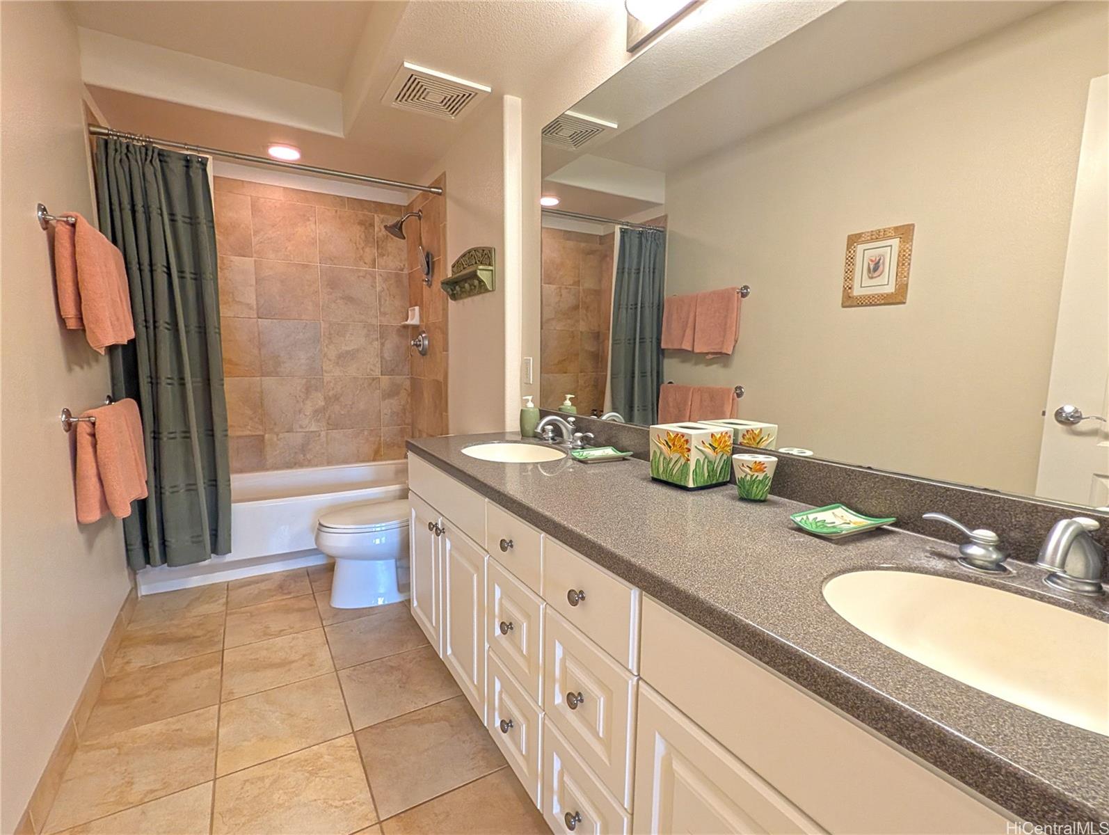 92-1057 Koio Drive, Unit F Kapolei, HI 96707 - Photo 10 of 18 Primary Bathroom with 2 Sinks and Full Horizontal Mirror