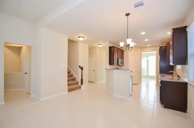 a view of a kitchen and a chandelier