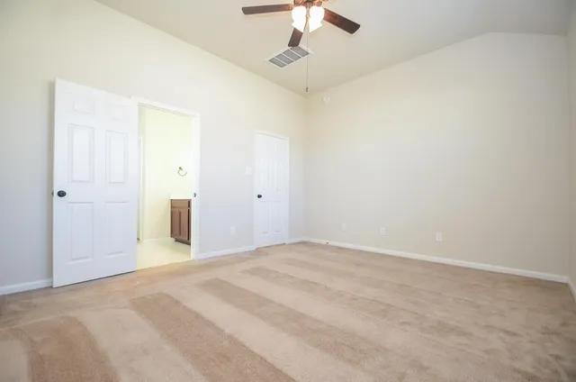 a view of a livingroom with a chandelier fan