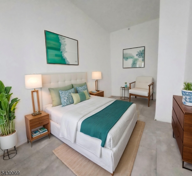 30 Howe Avenue, Unit 303 Passaic, NJ 07055 - Photo 6 of 11 a bedroom with bed and a potted plant