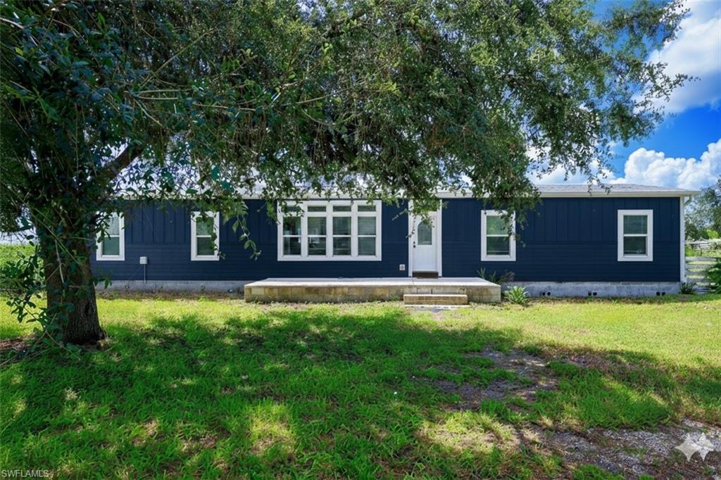 a house with swimming pool in front of it