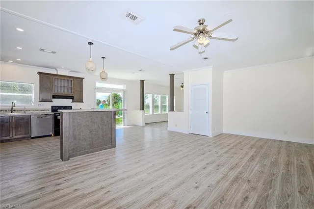 a view of a kitchen with microwave and a stove
