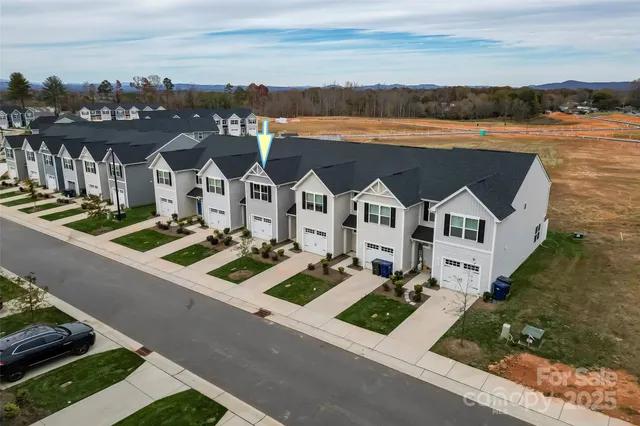 a view of multiple houses with a road