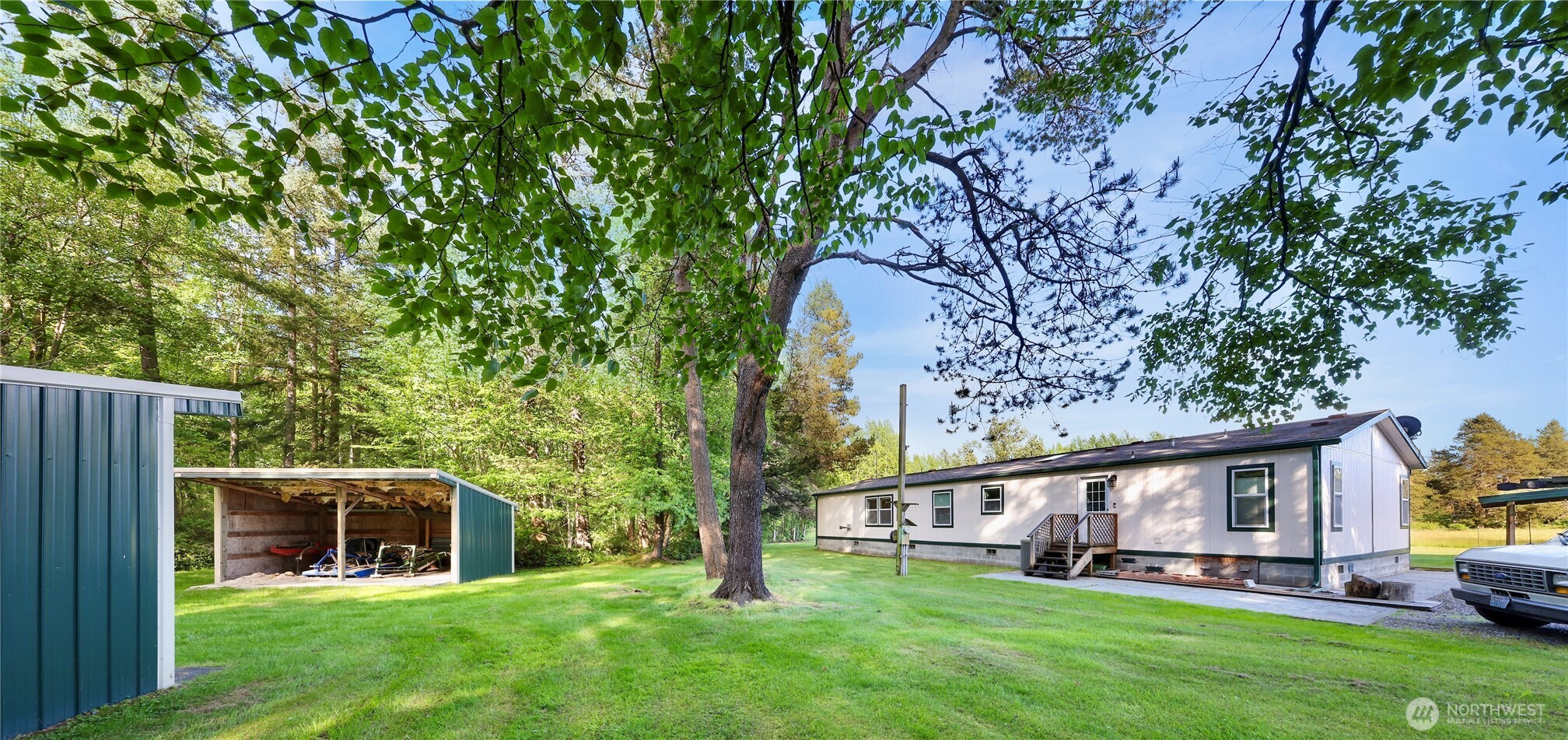 7928 Portal Way Custer, WA 98240 - Photo 31 of 39 a view of a house with a yard deck and a large tree