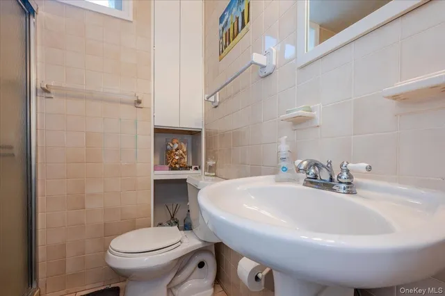 a bathroom with a sink and toilet