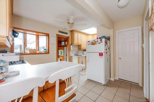 a kitchen with a refrigerator and countertop