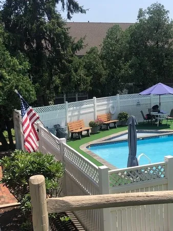 a view of a wooden deck and a yard